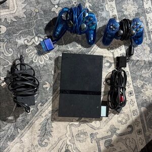 Sony Black Console with Blue Controllers